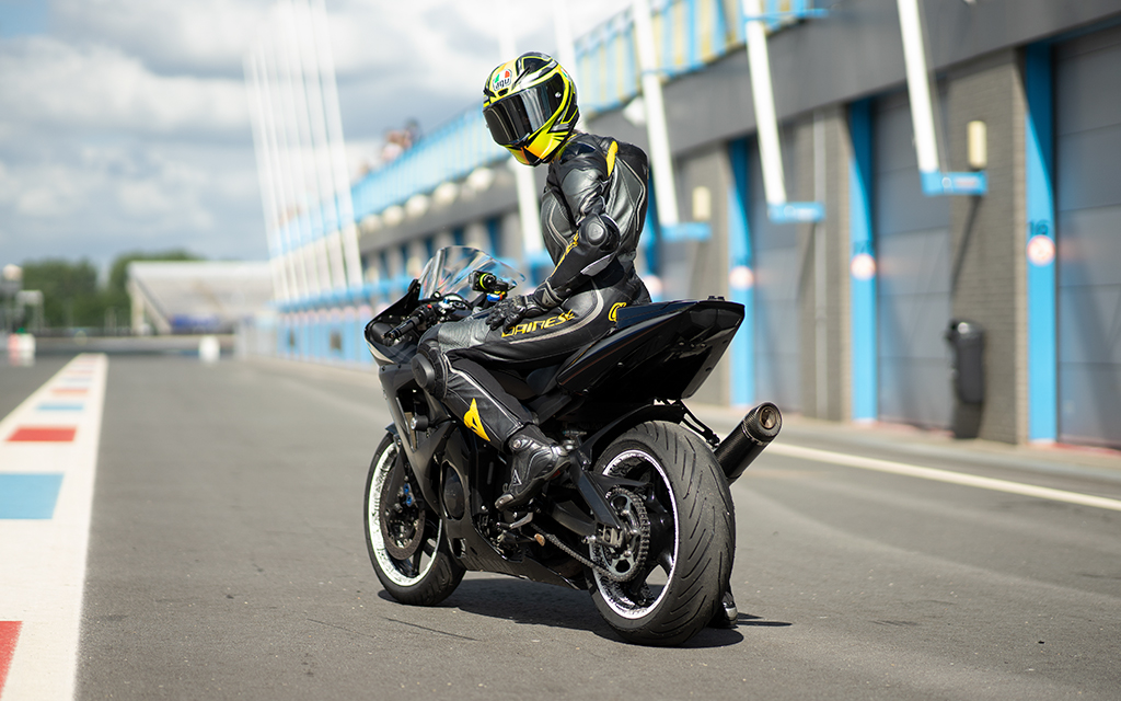 Chantal Doortje sitting on a black motorcycle