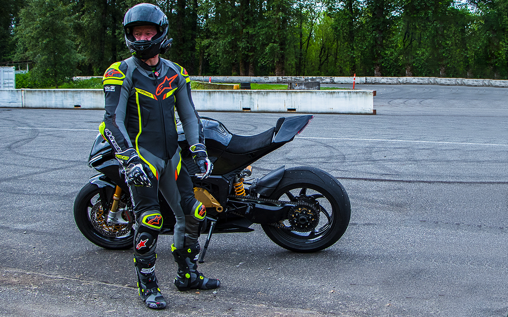 Jay Giraud Damon CEO in front the Damon HyperSport on the track