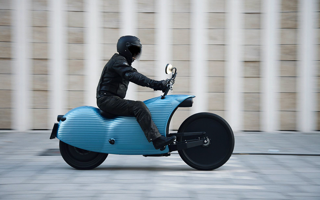 rider on a blue johammer j1200 motorcycle