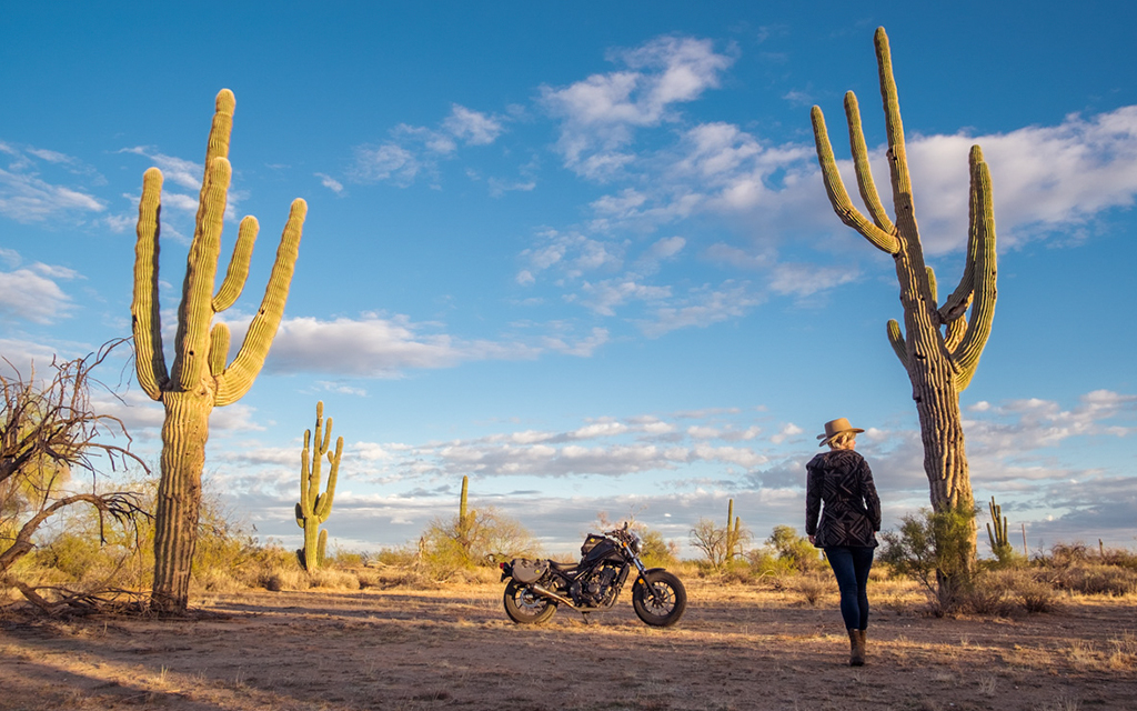 Motolady in the desert with her bike